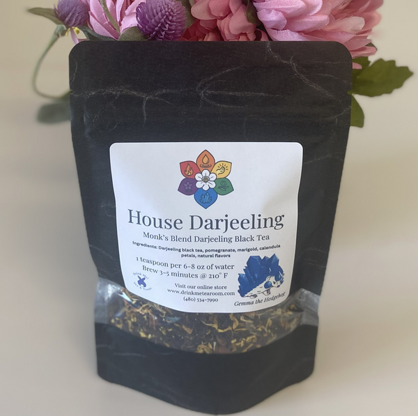 Black tea packaging with a label on a light background