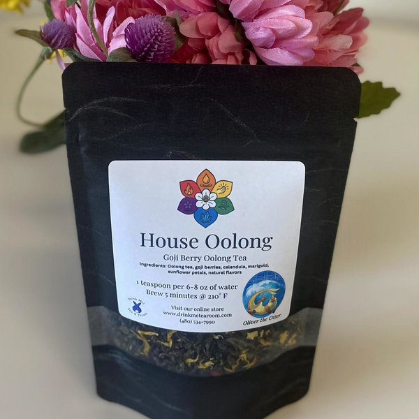 Black tea packaging labeled 'House Oolong' with a colorful flower logo on a white background.